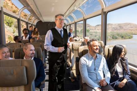 Train personnel and train goers in a car on Canyon Spirit railways.