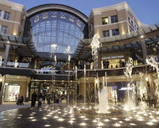 City Creek Center fountain lit up with people around it