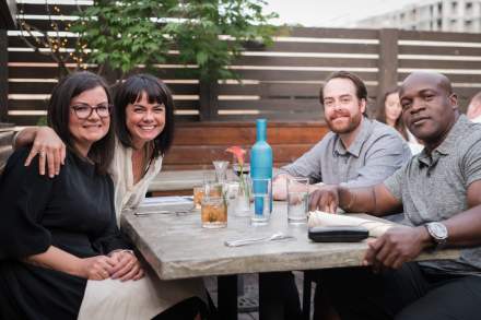 Image of people posing at Stoneground Kitchen's Rooftop