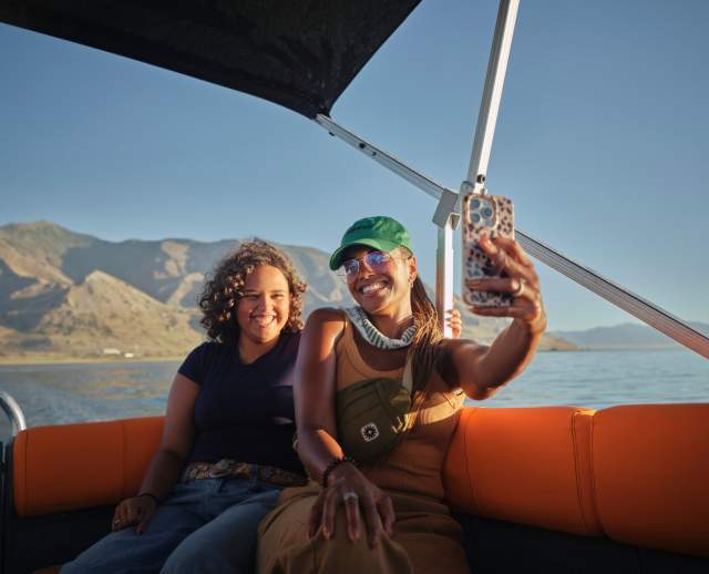 Mother and daughter taking a selfie on a boat tour of the Great Salt Lake.
