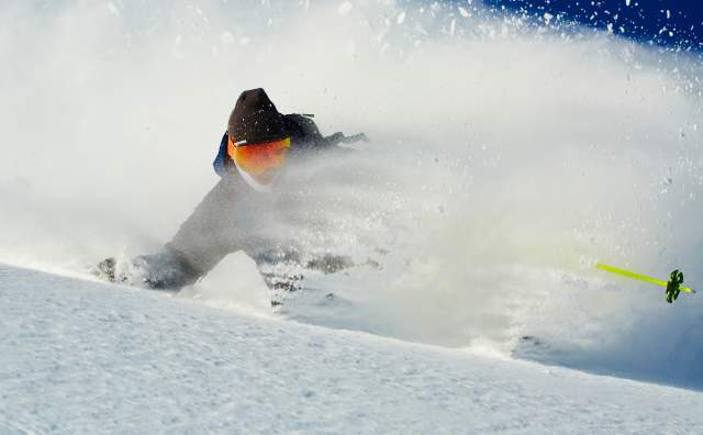 Skier in powder at Brighton Ski Resort