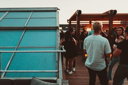 Image of people on the rooftop bar at SKY SLC