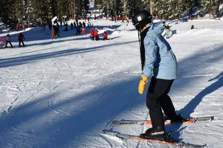 A skier makes her way down the beginner slope at Brighton Resort