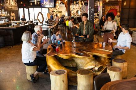 Family eating at the Gatway food hall, the HallPass