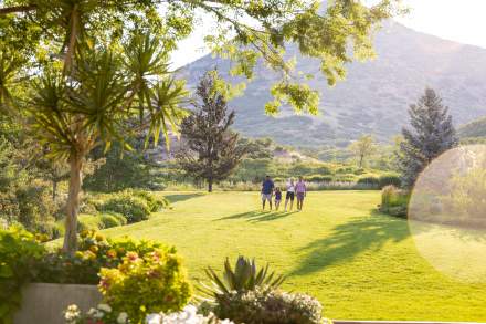 Image of a family walking through Red Butte Garden